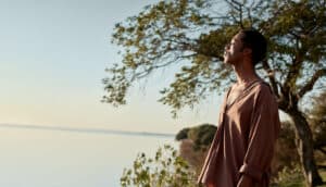 African American man with eyes closed as sunlight falls on his face, reflecting calm after ADHD therapy in Portland