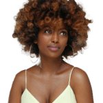 An African American woman looking contemplative, reflecting emotional processing, awareness, and health concerns.