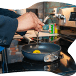  Hands cracking eggs into a pan, symbolizing daily routines, nourishment, and building healthy, supportive habits.