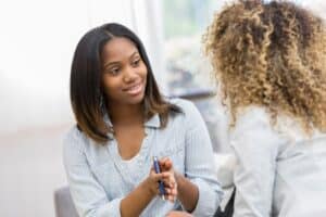 At Our Occupational therapy clinic, Portland, a consultation between a therapist and an African American client