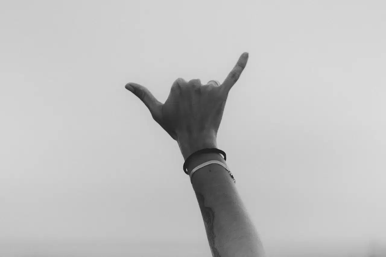 Raised hand against the sky representing hope, support, and progress through anxiety therapy