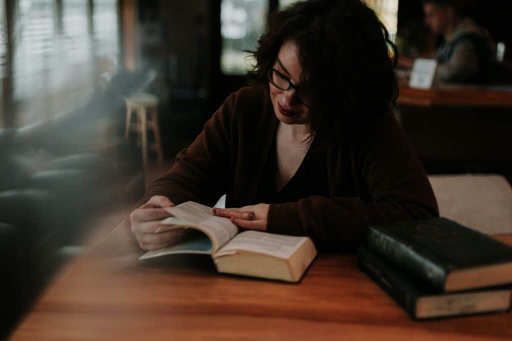 Chronic illness mental wellness shown through a quiet daily routine with reading and rest in a coffee shop setting