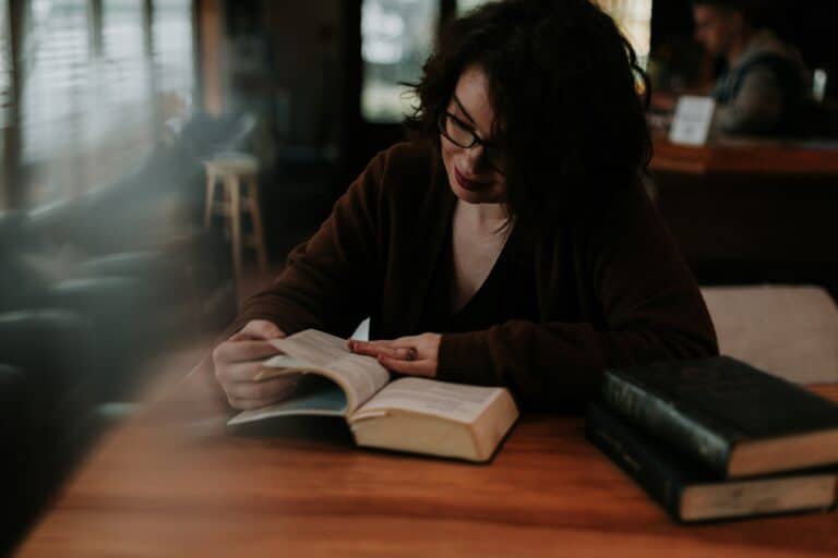 Chronic illness mental wellness shown through a quiet daily routine with reading and rest in a coffee shop setting