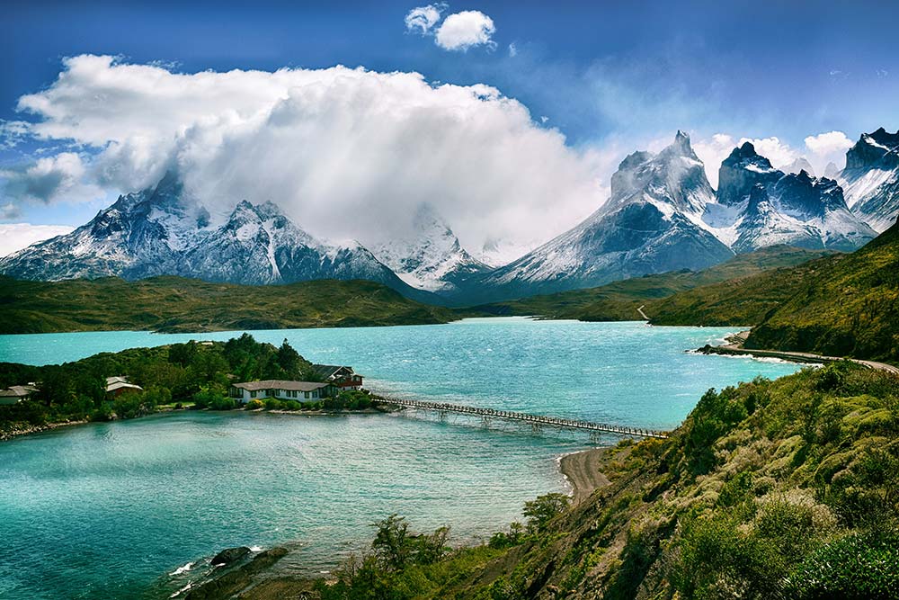 Lake near snow covered mountain during daytime