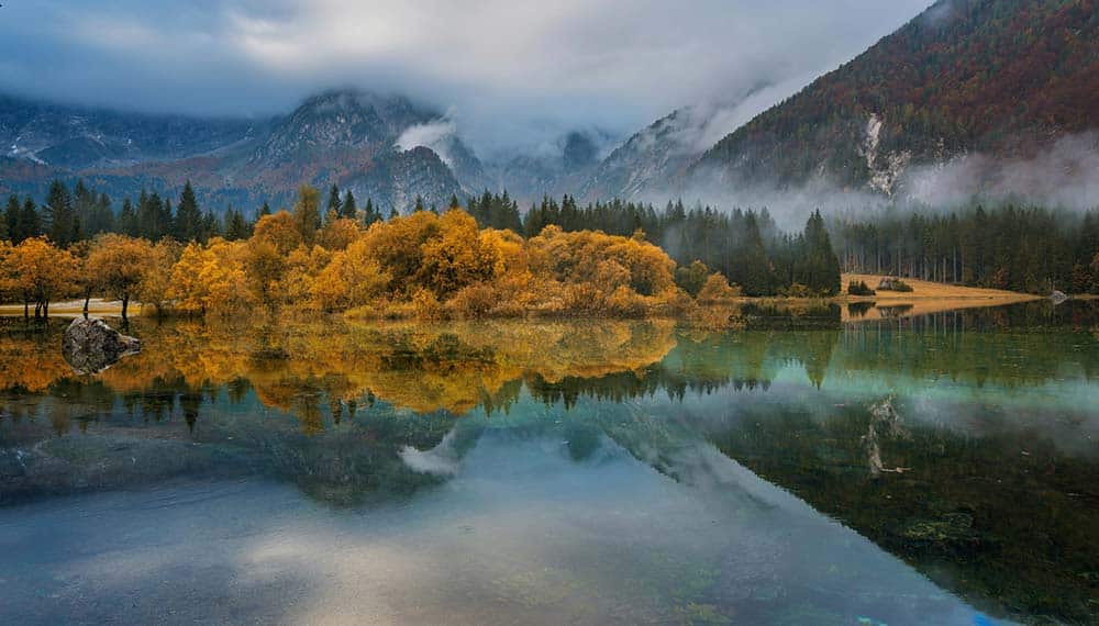 a lake surrounded by mountains